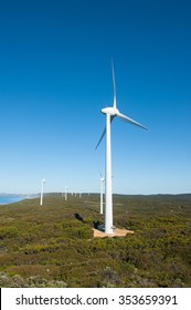 Wind farm along coast of Southern Ocean in Western Australia, producing renewable energy for town of Albany, summer sunny blue sky, copy space.