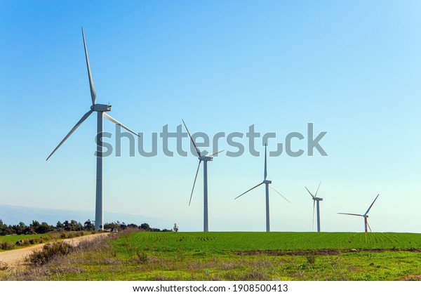  The wind farm consists of several scenic wind\
turbines. Warm winter in Israel. Gilboa - mountain range in the\
Jezreel Valley.