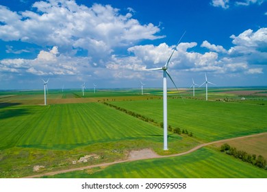 Wind farm in the field, filmed from a drone