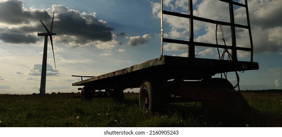 Wind Farm Field with Grain harvesting body - Shutterstock ID 2160905243