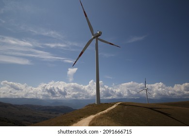 A Wind Farm, A Group Of Wind Turbines Used To Produce Electricity. It’s Sustainable, Renewable Energy For Enviromental. Italy, Europe, Russia, China, United States 