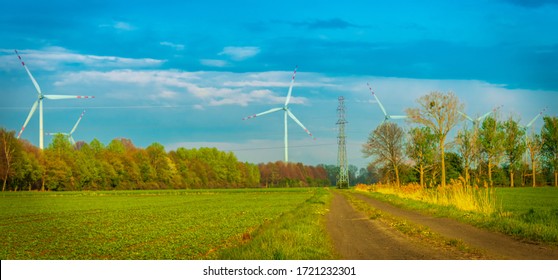 wind farm on the green field - Shutterstock ID 1721232301