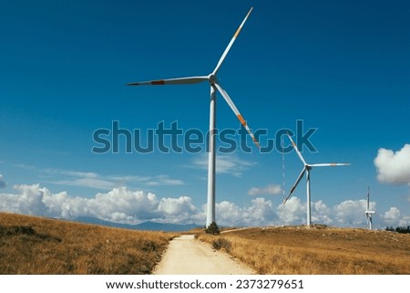 A wind farm or wind park, is a group of wind turbines used to produce electricity. This particular wind farm is located on the mountains of Italy and it allows to realize clean energy. enviromental