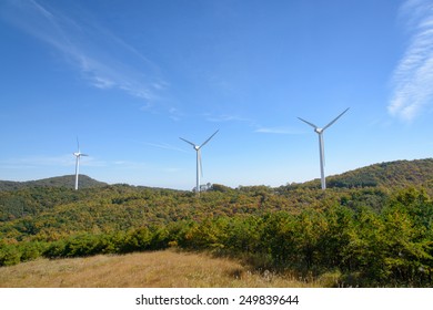 wind generator in a mountain with autumn colors