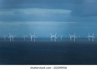 Wind Generators In Irish Sea, During Rain And Storm.