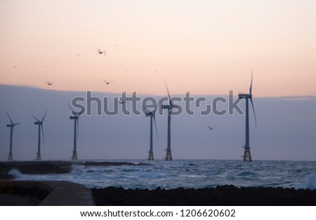 The wind generators in sunset view on Jeju Island in South Korea. 