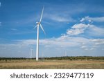 Wind Mill India.View of wind farm or wind park, with high wind turbines for generation electricity.Gomangalampudur, Pollachi, Tamil Nadu India