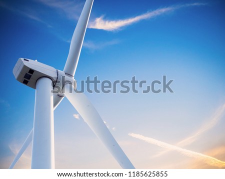 wind mill or also wind-turbine on wind farm in rotation to generate electricity energy on outdoor with sun and blue sky
, conservation and sustainable energy concept.