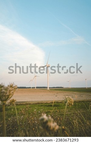 Similar – Image, Stock Photo Wind power to boost sustainability and green energy in the Ghent, Belgium. Turning wind into energy