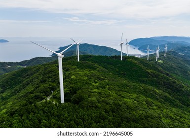 Wind Power Generation Windmills Lined Up On The Mountain. Aerial View.