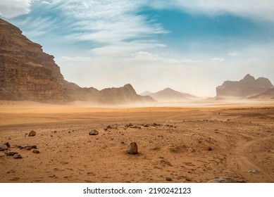 The wind raises the dust in Wadi Rum, Sahara or Arabian desert - Shutterstock ID 2190242123
