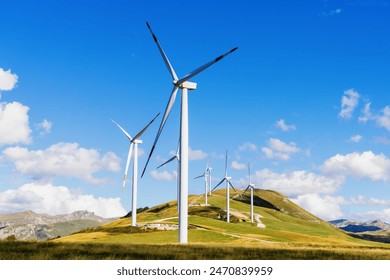 Wind renewable energy. Windmills in the highlands. Production of electric energy. - Powered by Shutterstock