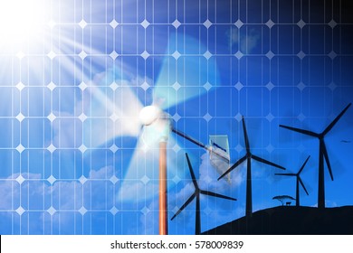 Wind and Solar Energy Concept - Solar panel and a group of wind turbines on a blue sky with clouds and sunbeams