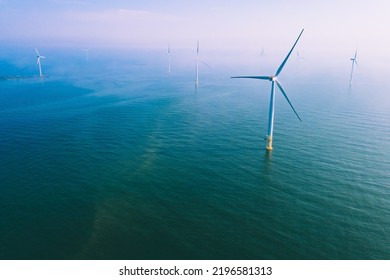 Wind Turbine. Aerial View Of Wind Turbines Or Windmills Farm Field In Blue Sea In Finland. Sustainable Green Clean Energy.