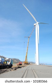 Wind Turbine And Crane Under Maintenance