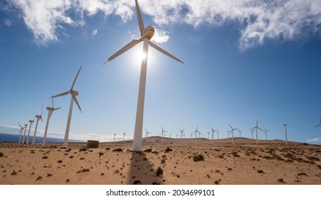 wind turbine in the desert with blue sky  background. wind mill farm in california desert - Powered by Shutterstock