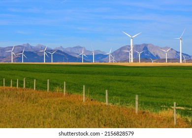 A wind turbine is a device that converts the kinetic energy of wind into electrical energy in installations known as wind farms.  - Shutterstock ID 2156828579