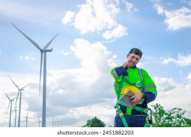 Wind turbine Engineer experiencing neck pain at work. - Powered by Shutterstock