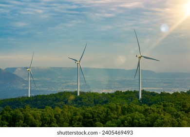 Wind turbine farm concetp, windmill or wind turbine on hill of blue sky and cloud background, technology sustainable energy of power, renewable energy future of green technology industry aeriel view - Powered by Shutterstock