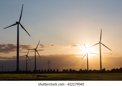 wind turbine farm sundown - Shutterstock ID 422179045