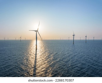 Wind turbine field over the sea in the evening - Shutterstock ID 2288170307
