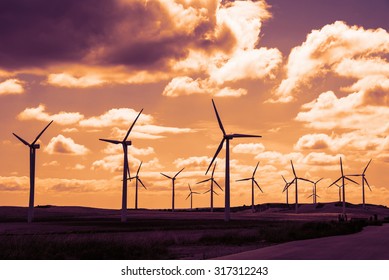 Wind Turbine Field At Sunset, Dramatic Sky