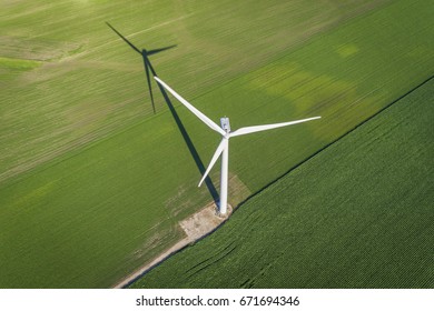 Wind Turbine In A Green Field, Top Aerial View