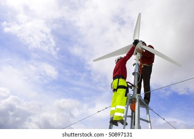 A Wind Turbine Maintenance In A Beautiful Blue And Cloud Sky