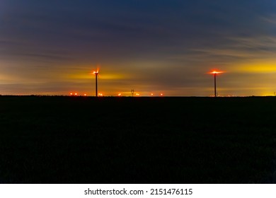 Lot Of Wind Turbine At Night, With A Cloud Sky, Ine Meuse Department, France