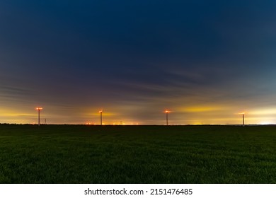 Lot Of Wind Turbine At Night, With A Cloud Sky, Ine Meuse Department, France