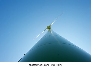 Wind Turbine On A Sunny Summer Afternoon.  Wide Angle.