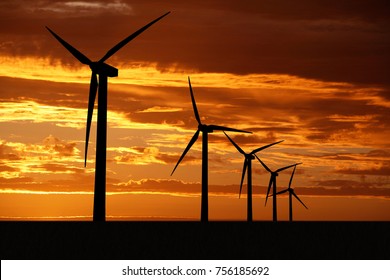 Wind Turbine On Sunset Background