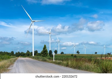 Wind turbine power generator on blue sky - Shutterstock ID 220132672