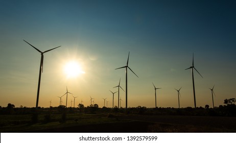 Wind turbine power generator at twilight - Shutterstock ID 1392579599