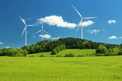 Wind Turbine Renewable Energy Source Summer Landscape With Clear Blue Sky And Field In The Foreground