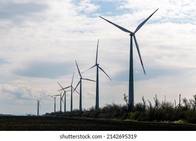 Wind Turbine Replaces Old Coal Plant With High Voltage Power Line For Clean Energy