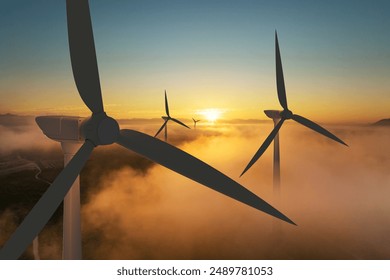 Wind turbine silhouette at sunrise, wind energy and nature concept. - Powered by Shutterstock