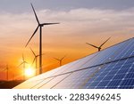 wind turbine with solar panels and sunset. concept clean energy. Energy supply, wind turbine,eolic turbine, distribution of energy,Powerplant,energy transmission,high voltage supply concept