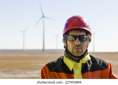 Wind turbine technician looking at camera