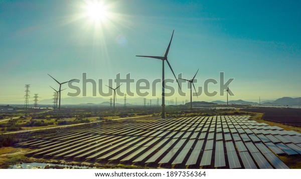 Wind turbine tower construction with beautiful\
landscape and blue sky to generate clean renewable green energy for\
sustainable development to prevent climate change and global\
warming to protect earth