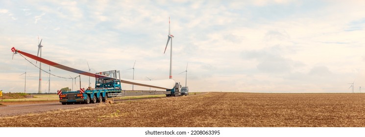 Wind Turbine Under Construction. Blade For Wind Turbines Close Up. Special Transport Of A Blade For A Wind Turbine On A Special Semi-trailer