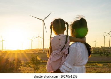Wind turbines are alternative electricity sources, the concept of sustainable resources, People in the community with wind generators turbines, Renewable energy. - Shutterstock ID 1917061136
