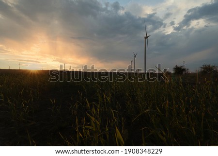 wind turbines with beautiful sunset sky, zorlu energy wind turbines installed in jhampir near gharo sindh Pakistan. renewable energy, green energy 