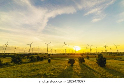 Wind turbines, Eco power and agricultural fields with sunset landscapes, Energy Production with clean and Renewable Energy. Protection of nature. - Shutterstock ID 1829470397