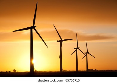 Wind Turbines Farm By Sunrise