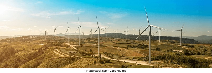wind turbines in a field, wind turbine farm sundown, Wind Power Turbines in a rural area, Tracking shot of energy producing wind turbines in Oregon. - Shutterstock ID 2259981559