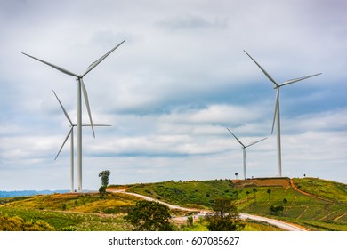 Wind turbines generate electricity to reduce global warming. Located on the hill. - Shutterstock ID 607085627