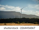 Wind turbines at the mountain landsape. Green power energy generation. Ukraine