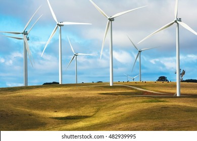 Wind turbines on cattle farm for producing alternative energy, Taralga, NSW, Australia,