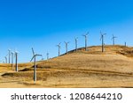 Wind turbines on the hills at Altamont Pass, in California, with morning light